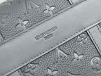 Louis Vuitton bag close-up of gray monogram lining with stitched interior panel