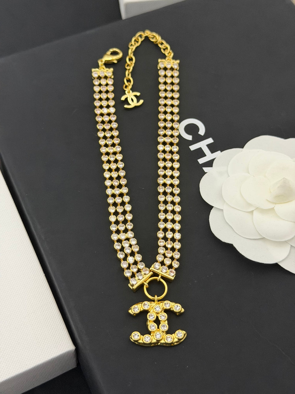 Gold-tone rhinestone long necklace with CC charm and pearl-style drop pendants