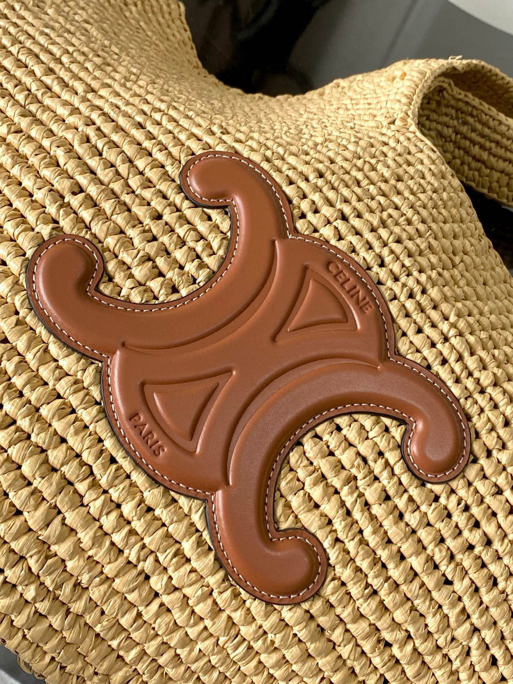 Celine logo patch on woven straw fabric with brown leather finish