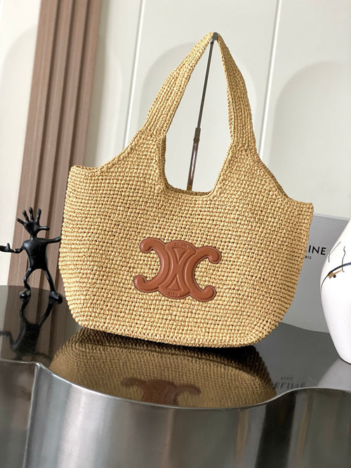 Woven straw tote bag with Celine logo patch and leather-trimmed open top