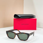 Tortoiseshell full-rim sunglasses with dark lenses and slim gold temple details