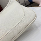 Gucci white leather bag edge close-up with fine stitching along seam