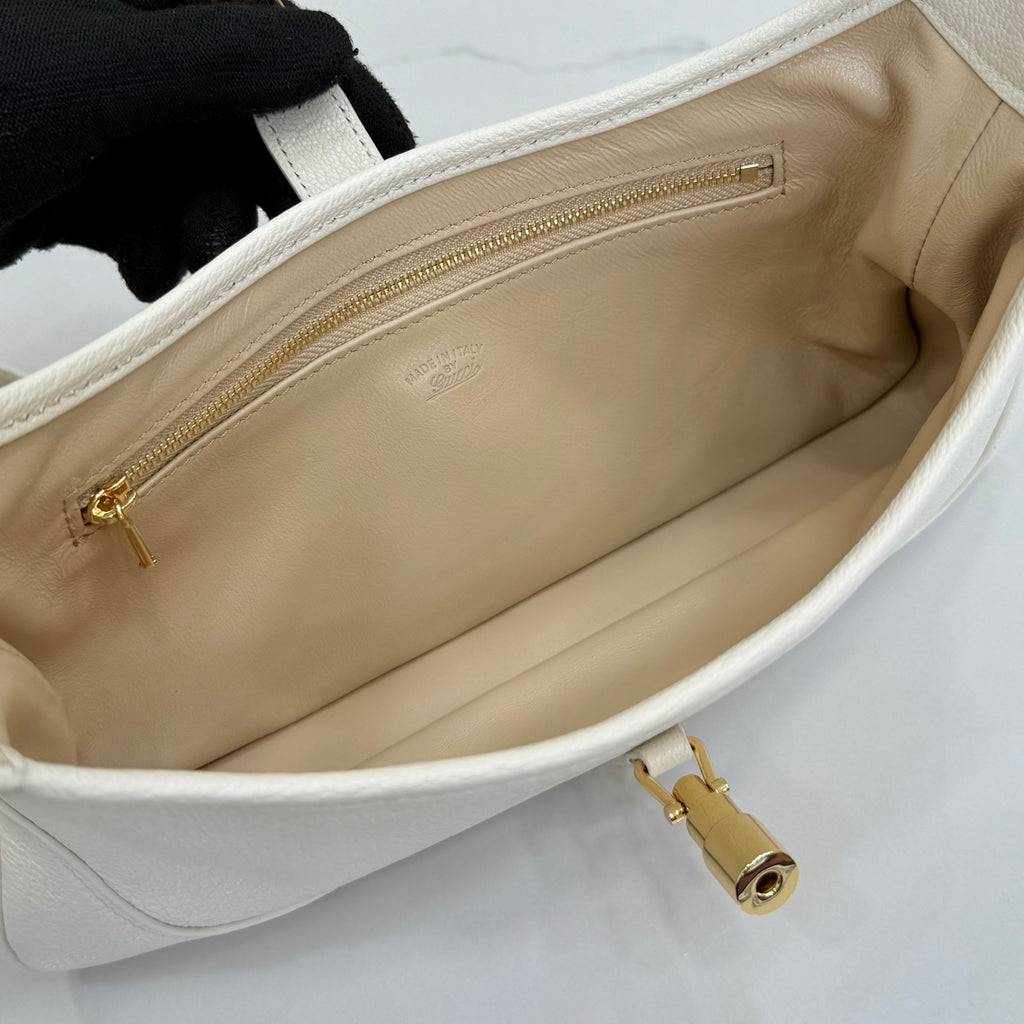Gucci white leather hobo bag interior with beige lining and top zipper