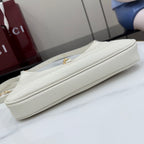 Gucci white leather hobo bag side view with flat strap and gold-tone clasp