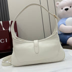 Gucci white leather hobo bag with curved top handle and gold-tone zipper pull