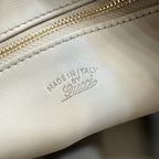 White leather bag with 'MADE IN ITALY' embossed stamp