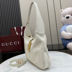 White leather hobo bag angled view with gold zipper detail