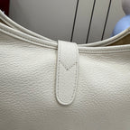 White textured leather bag top with strap and stitched panel