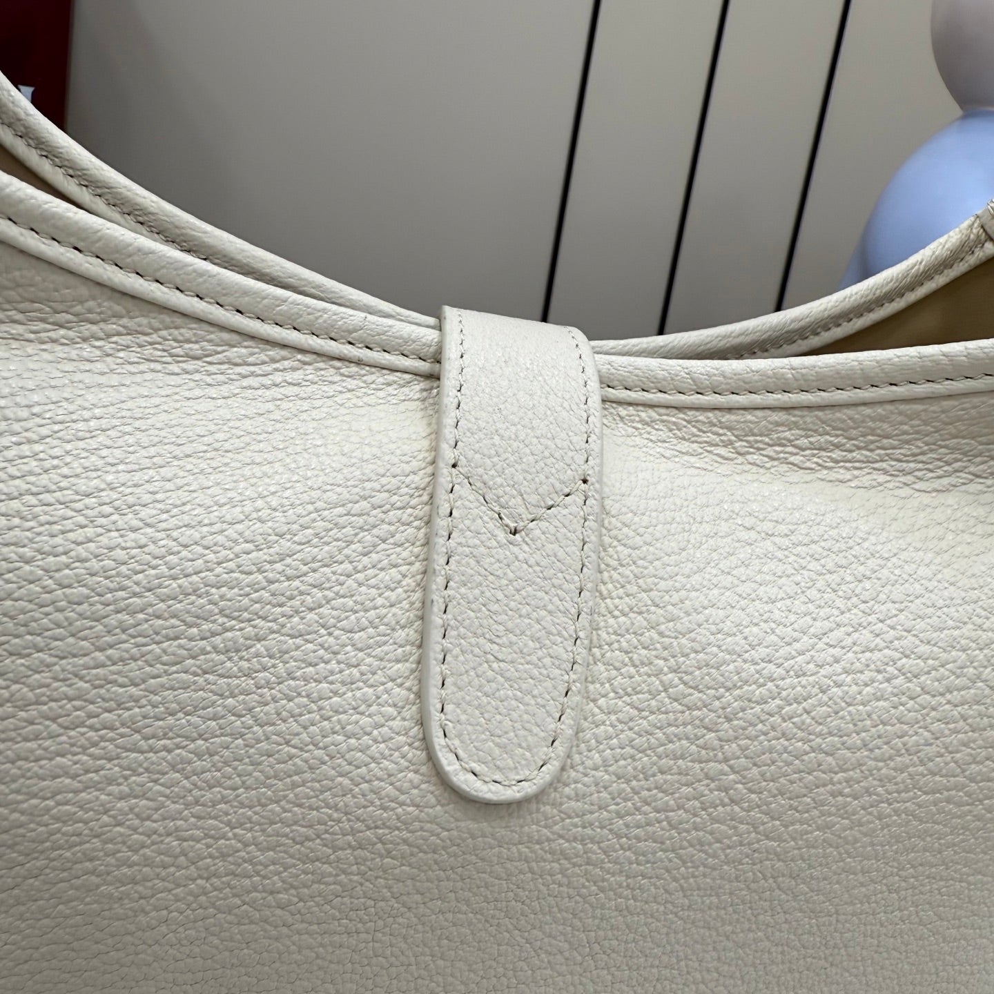 White textured leather bag top with strap and stitched panel