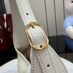 White leather strap end with gold-tone oval buckle hardware