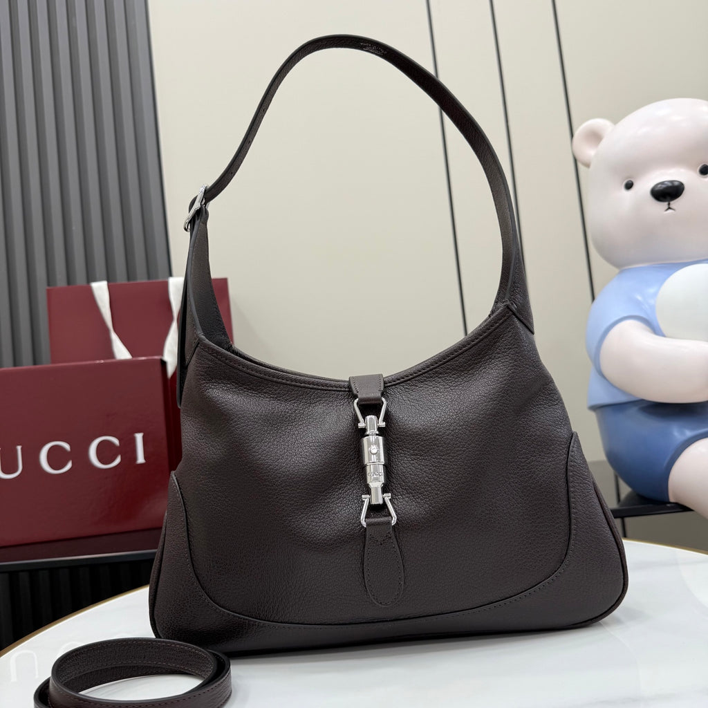 Dark brown leather hobo bag with top handle and front zipper pull