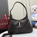 Dark brown leather hobo bag with top handle and front zipper pull