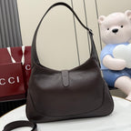 Dark brown leather hobo bag with curved top handles and central zipper closure