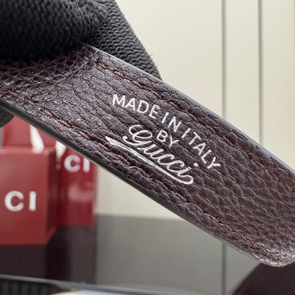 Stamped 'Made in Italy' and Gucci text on leather strap
