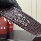 Stamped 'Made in Italy' and Gucci text on leather strap