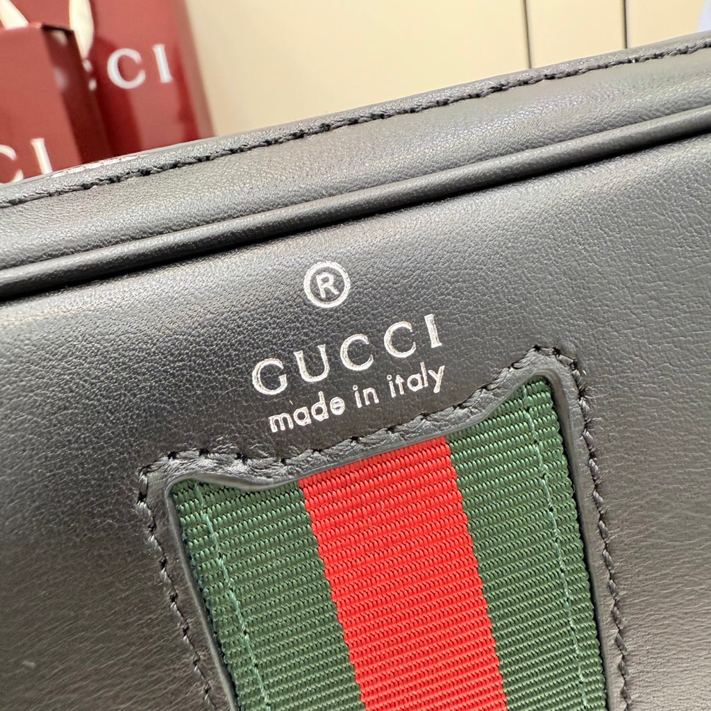 Gucci web stripe patch on black leather with Gucci made in Italy text