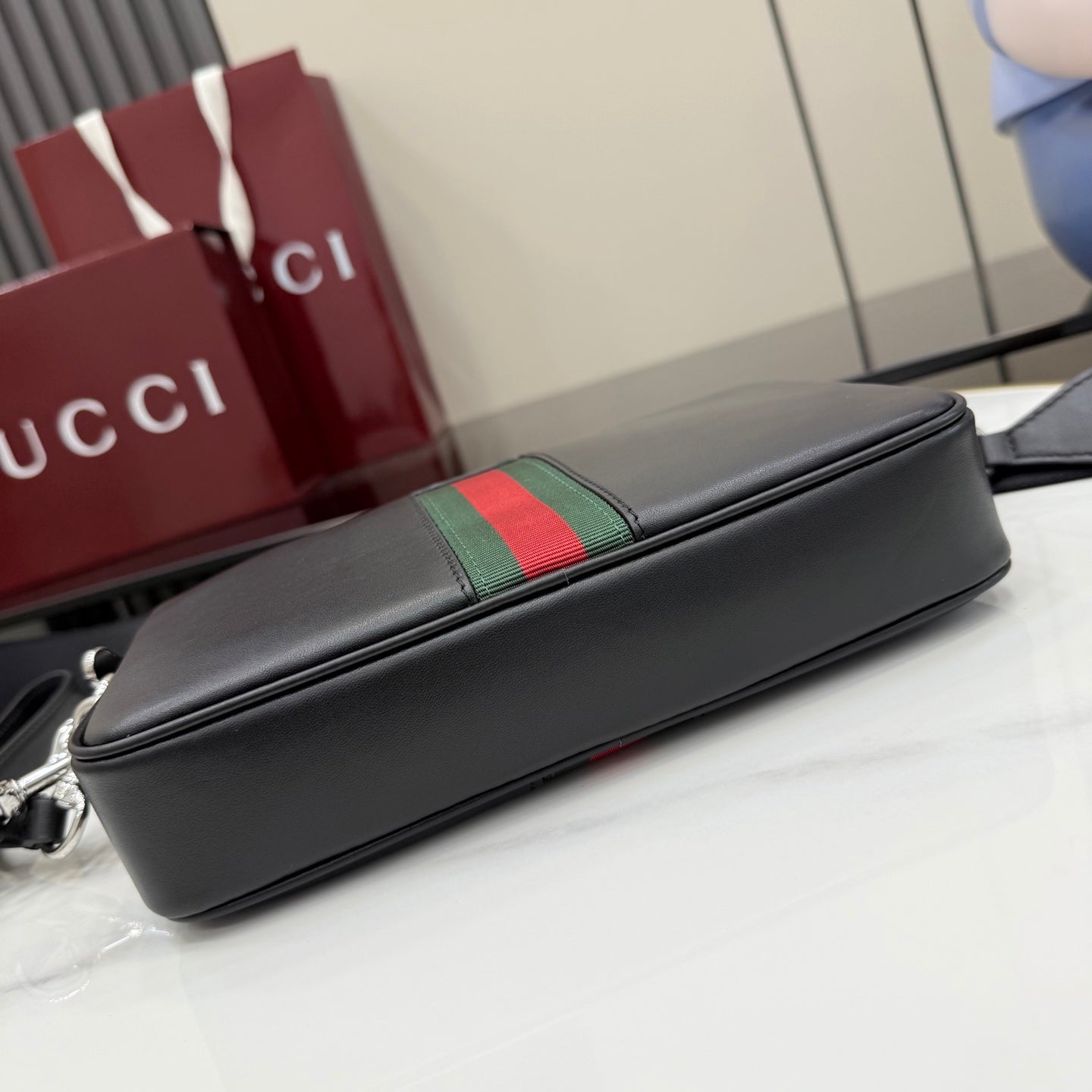 Gucci leather crossbody bag, black with green and red web detail on top