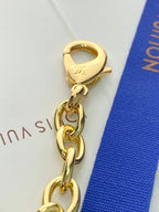 Louis Vuitton small bag gold keyring clasp with chain link and LV stamp