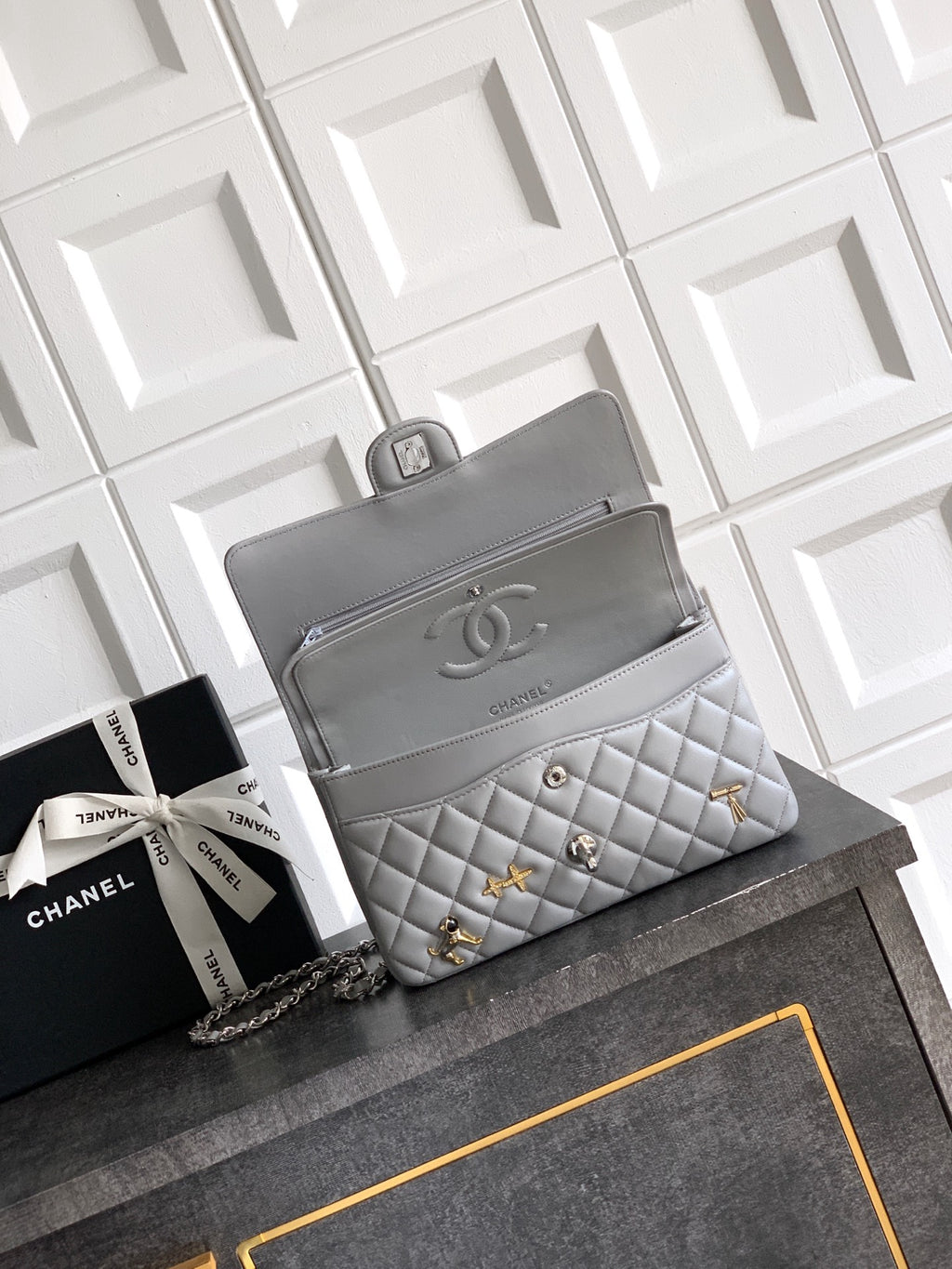 Chanel quilted shoulder bag with chain strap and flap front, light gray