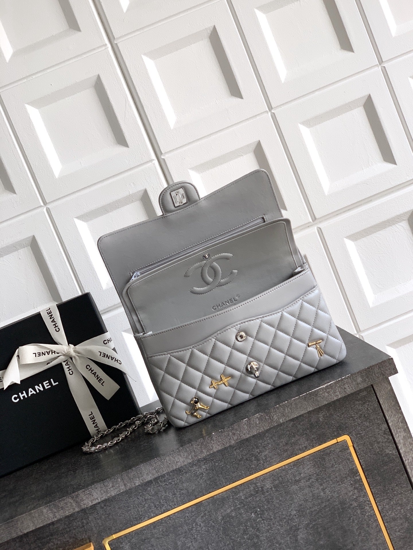 Chanel quilted shoulder bag with chain strap and flap front, light gray