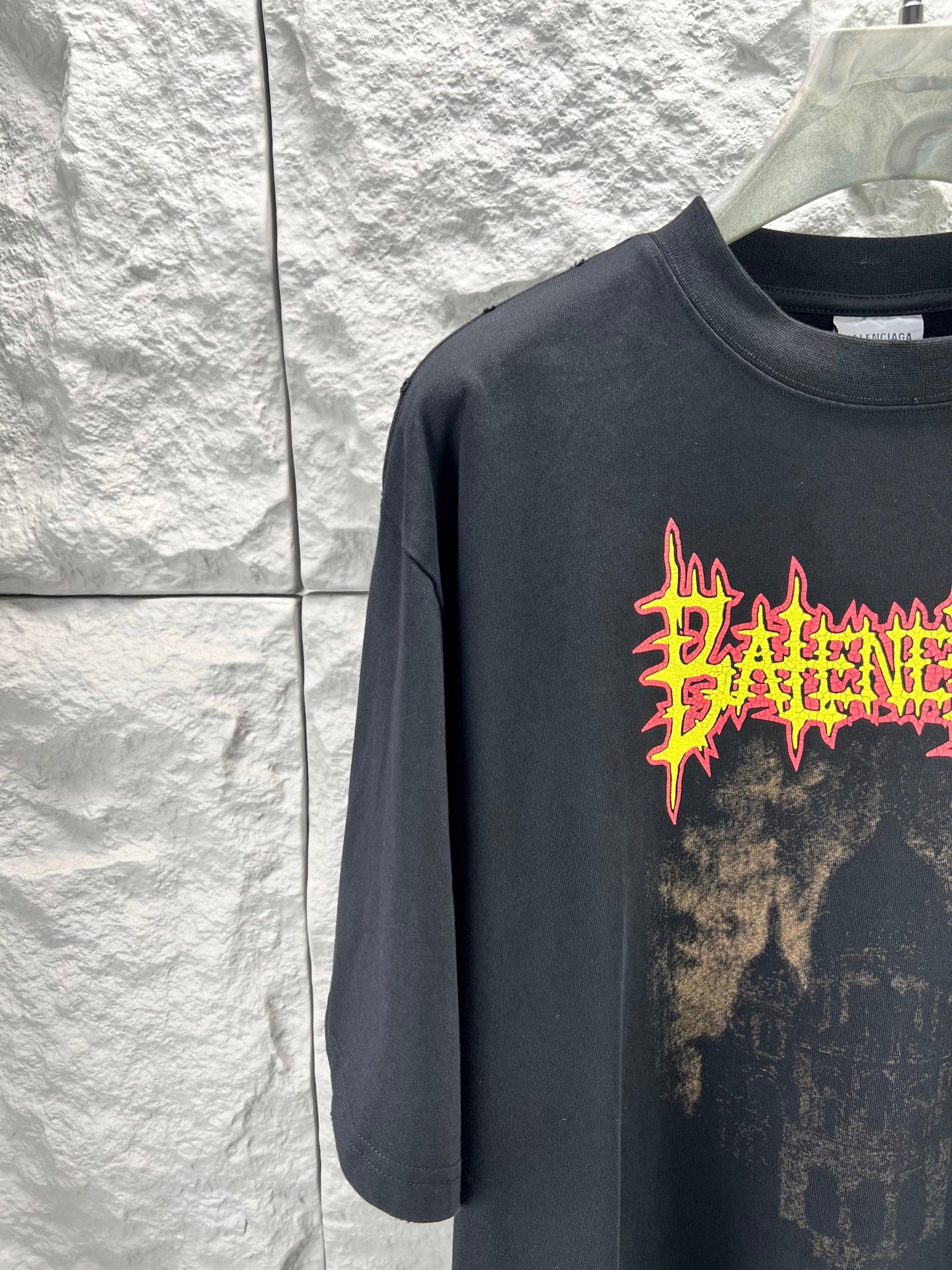 Balenciaga dark short-sleeve T-shirt with orange and yellow logo graphic