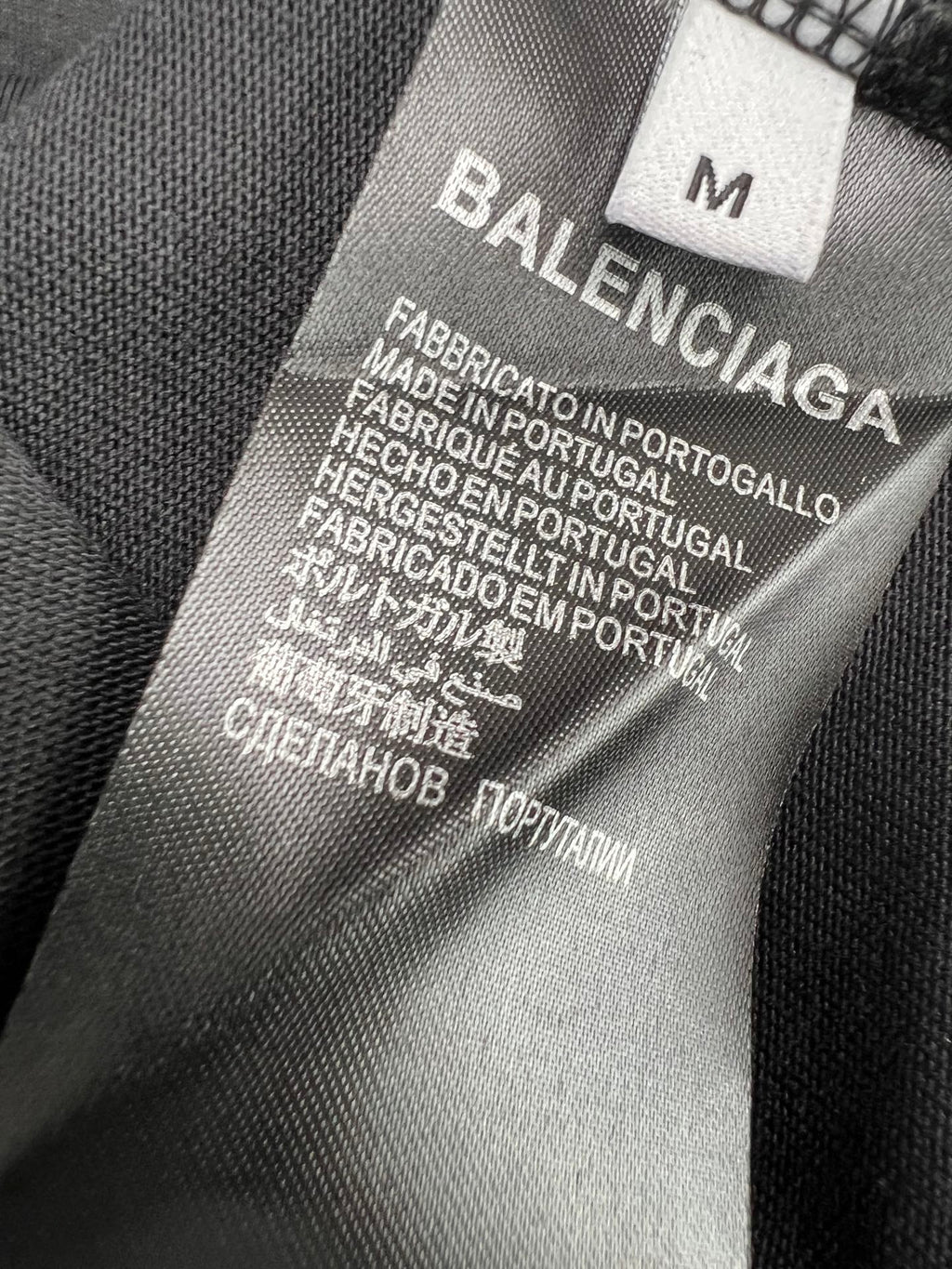 Balenciaga fabric care label with size marker and production text