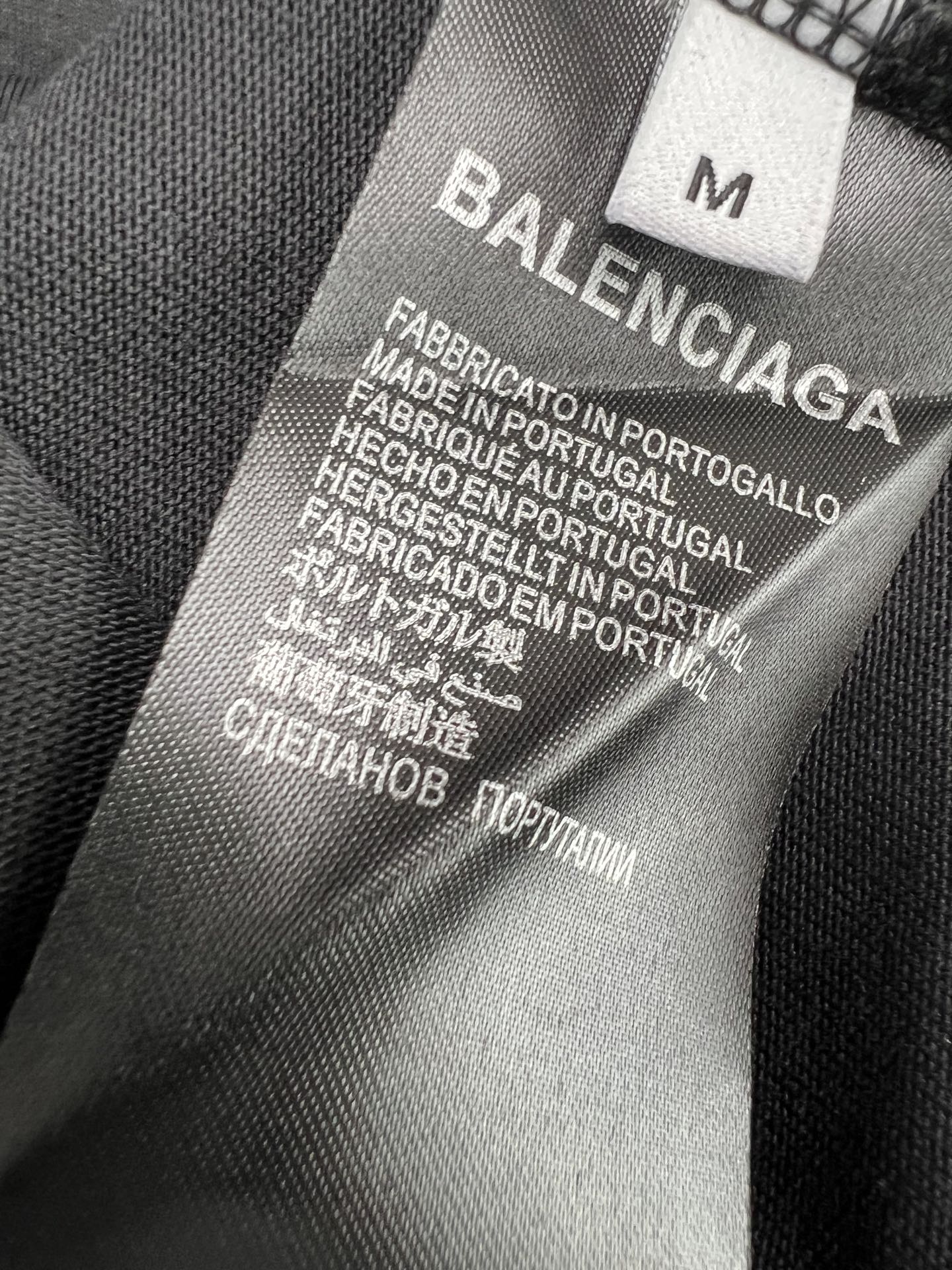 Balenciaga fabric care label with size marker and production text