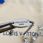 Oval Louis Vuitton Paris medallion on silver-tone charm bracelet with pearl accents