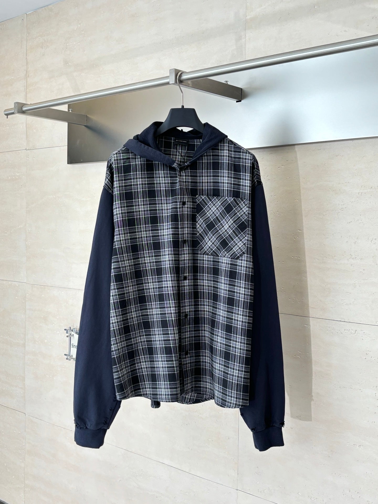 Long-sleeve hooded shirt in dark navy with black-and-white plaid front and pocket