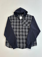 Long-sleeve hooded shirt with dark navy sleeves and black-and-white plaid front panel