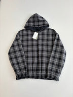 Black and white plaid zip-up hooded jacket with hood, elastic hem, and hang tag