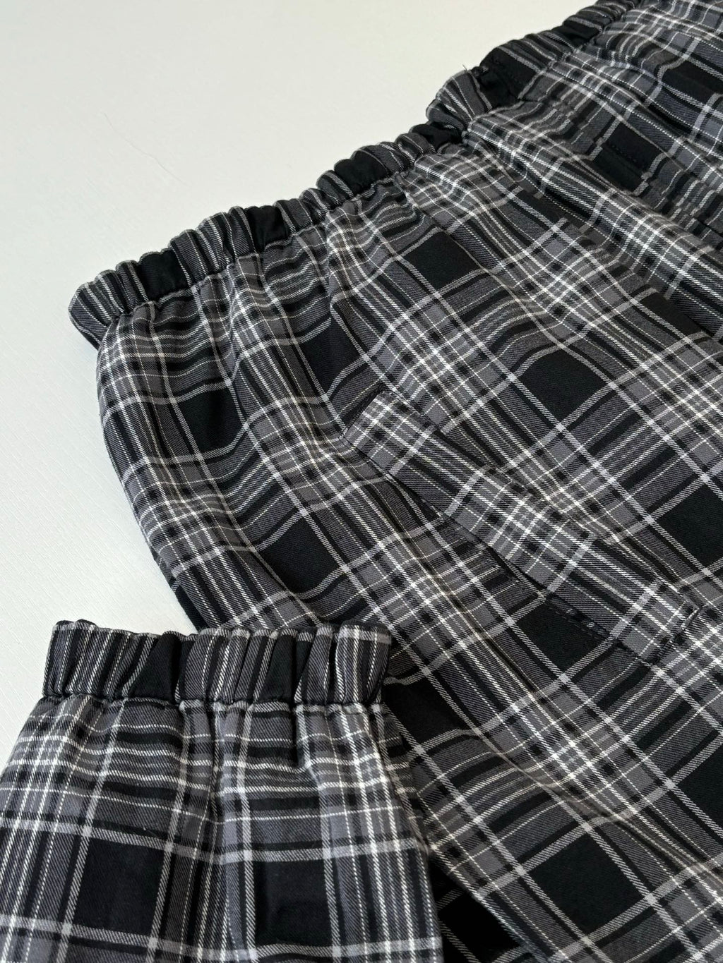 Black and white plaid hooded jacket cuff and drawstring detail