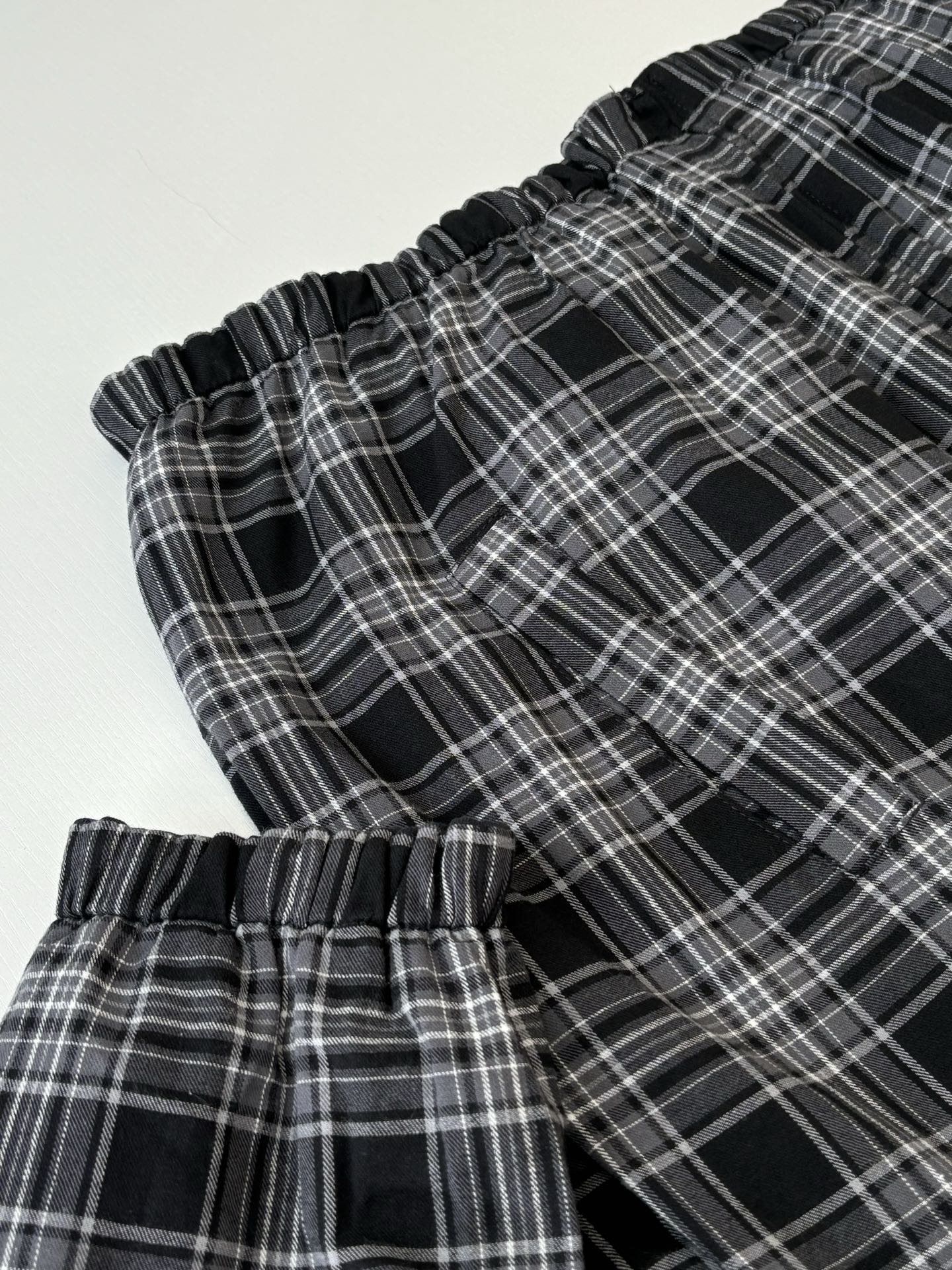 Black and white plaid hooded jacket cuff and drawstring detail
