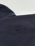 Dark navy fabric close-up with embossed Balenciaga logo