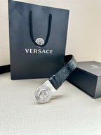 Dark blue embossed leather belt with silver Medusa buckle and gift packaging