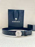 Dark blue leather belt with embossed texture and round silver Medusa buckle