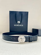 Dark blue leather belt with embossed texture and round silver Medusa buckle