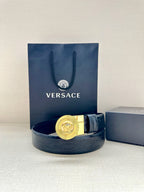 Versace dark leather belt with gold Medusa round buckle and curved strap
