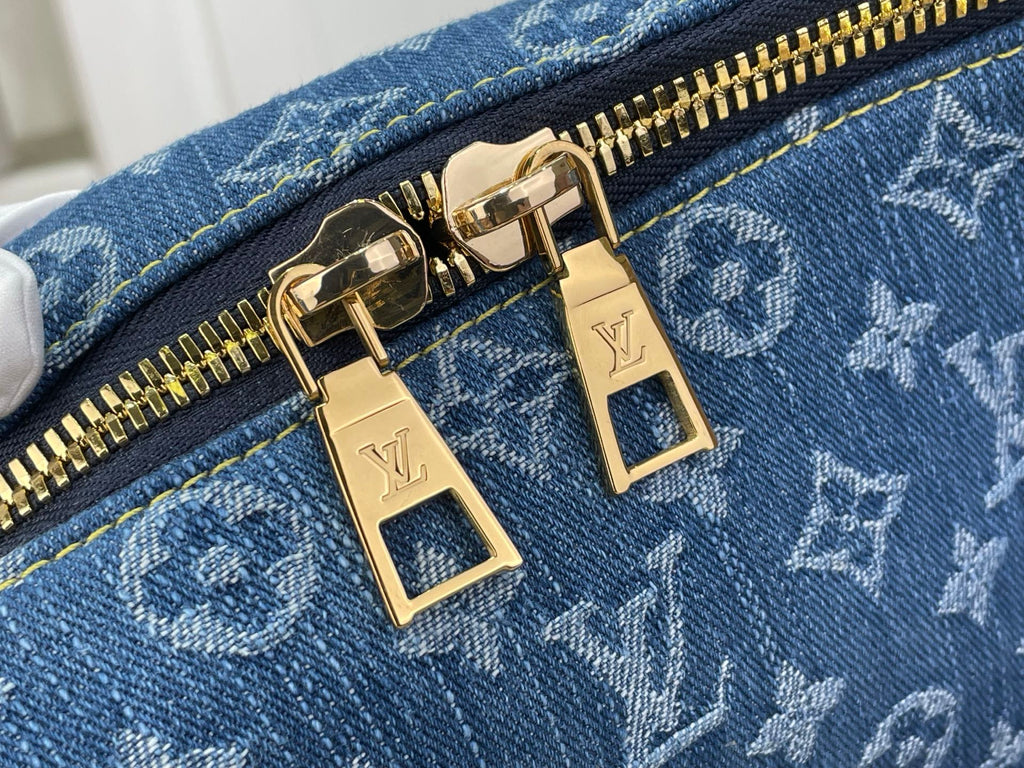 Louis Vuitton blue bag zipper with gold-tone pulls and monogram pattern