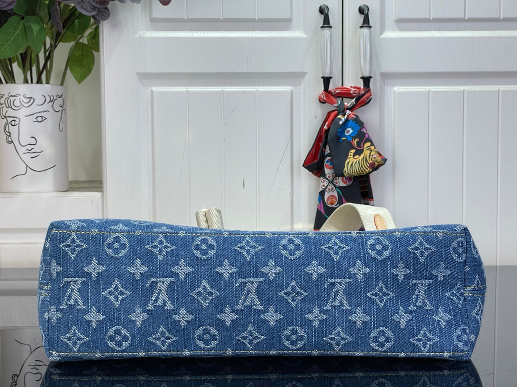 Louis Vuitton monogram hobo bag in blue with top flap and gold-tone edge