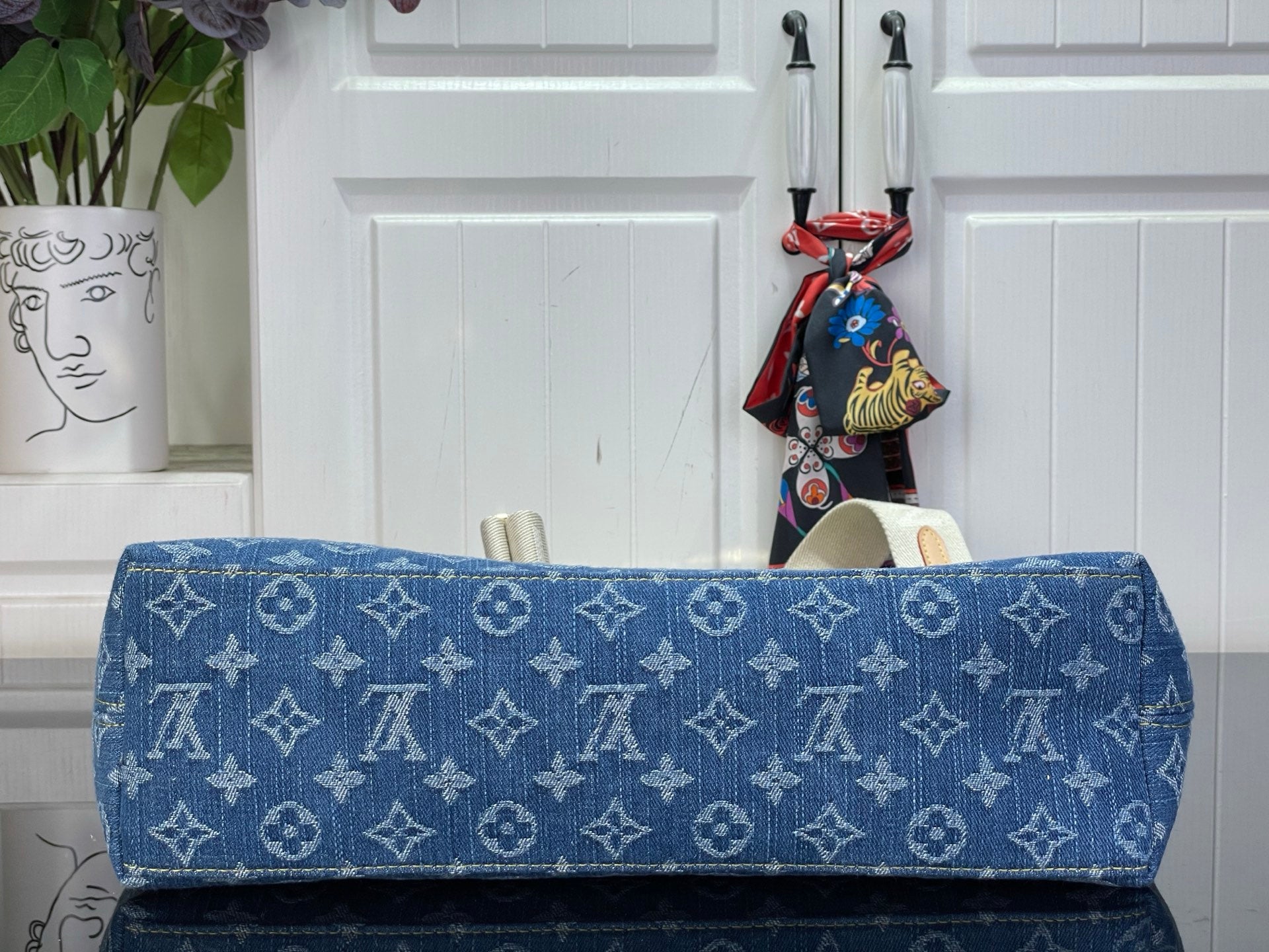 Louis Vuitton monogram hobo bag in blue with top flap and gold-tone edge