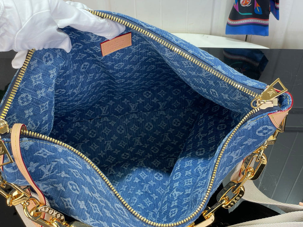 Louis Vuitton blue monogram bag open interior with fabric lining and zipper trim