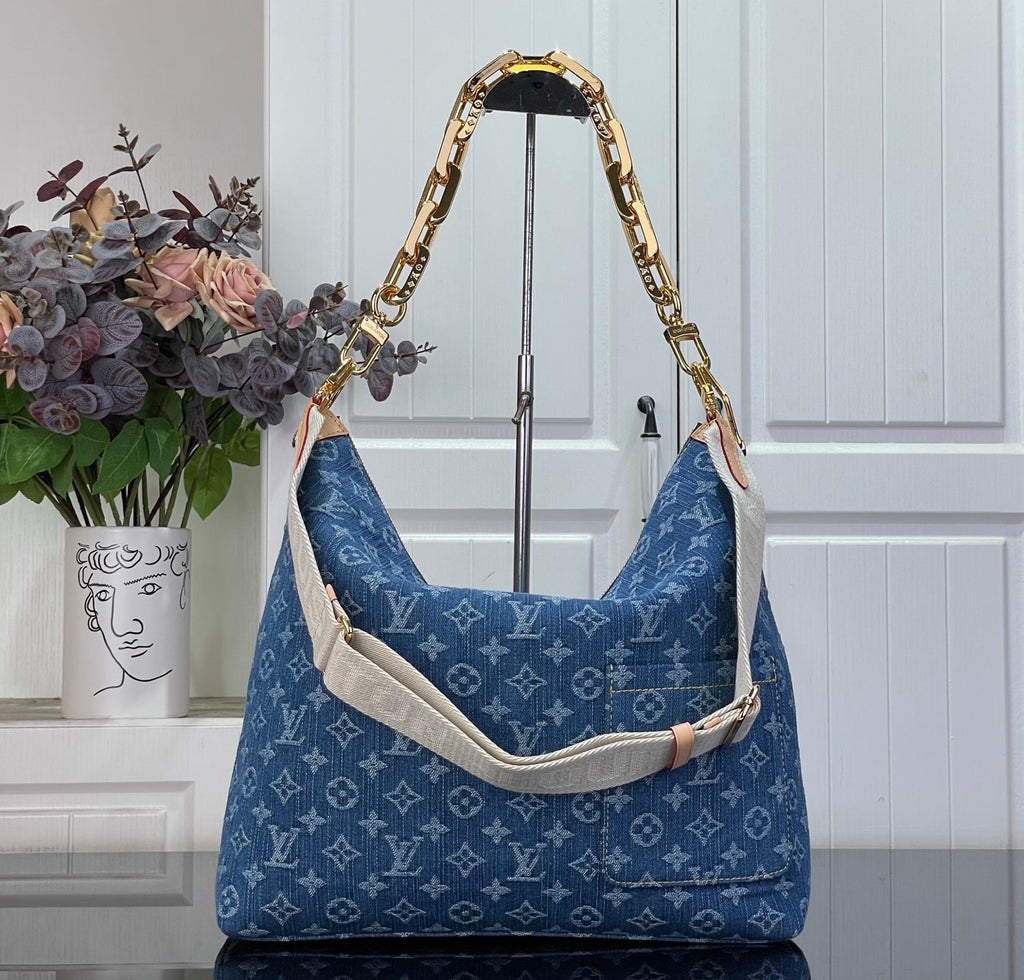 Louis Vuitton monogram hobo bag in blue with tan strap and gold-tone trim