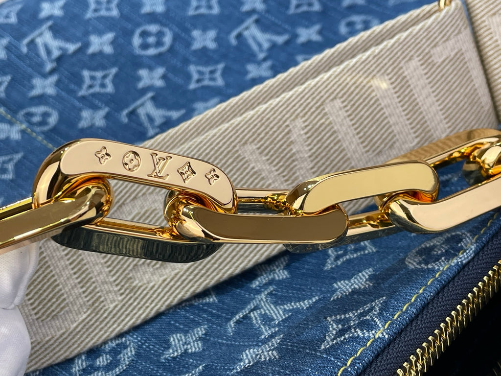 Louis Vuitton bag strap clasp and gold-tone hardware on blue monogram canvas