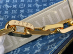 Louis Vuitton bag strap clasp and gold-tone hardware on blue monogram canvas
