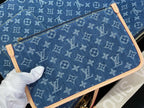 Louis Vuitton bag in blue monogram canvas with tan leather trim and top zipper