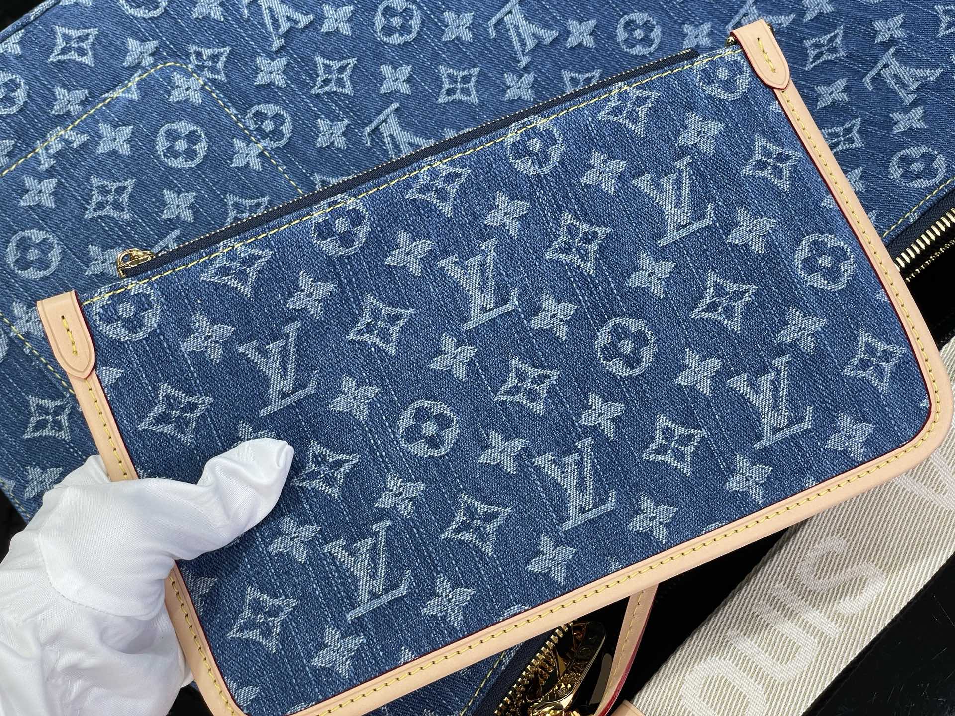 Louis Vuitton bag in blue monogram canvas with tan leather trim and top zipper