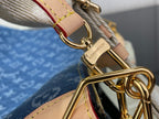 Louis Vuitton bag strap and gold-tone clasp detail over blue monogram canvas