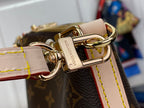 Louis Vuitton monogram bag clasp close-up with gold buckle and linked chain