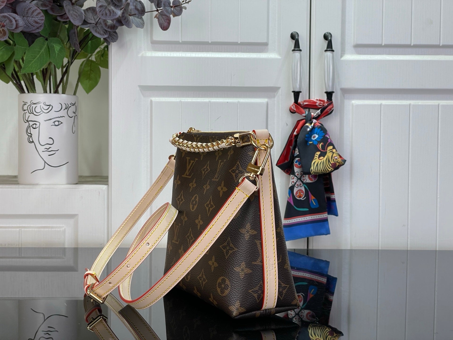 Louis Vuitton monogram shoulder bag with detachable strap and gold-tone trim